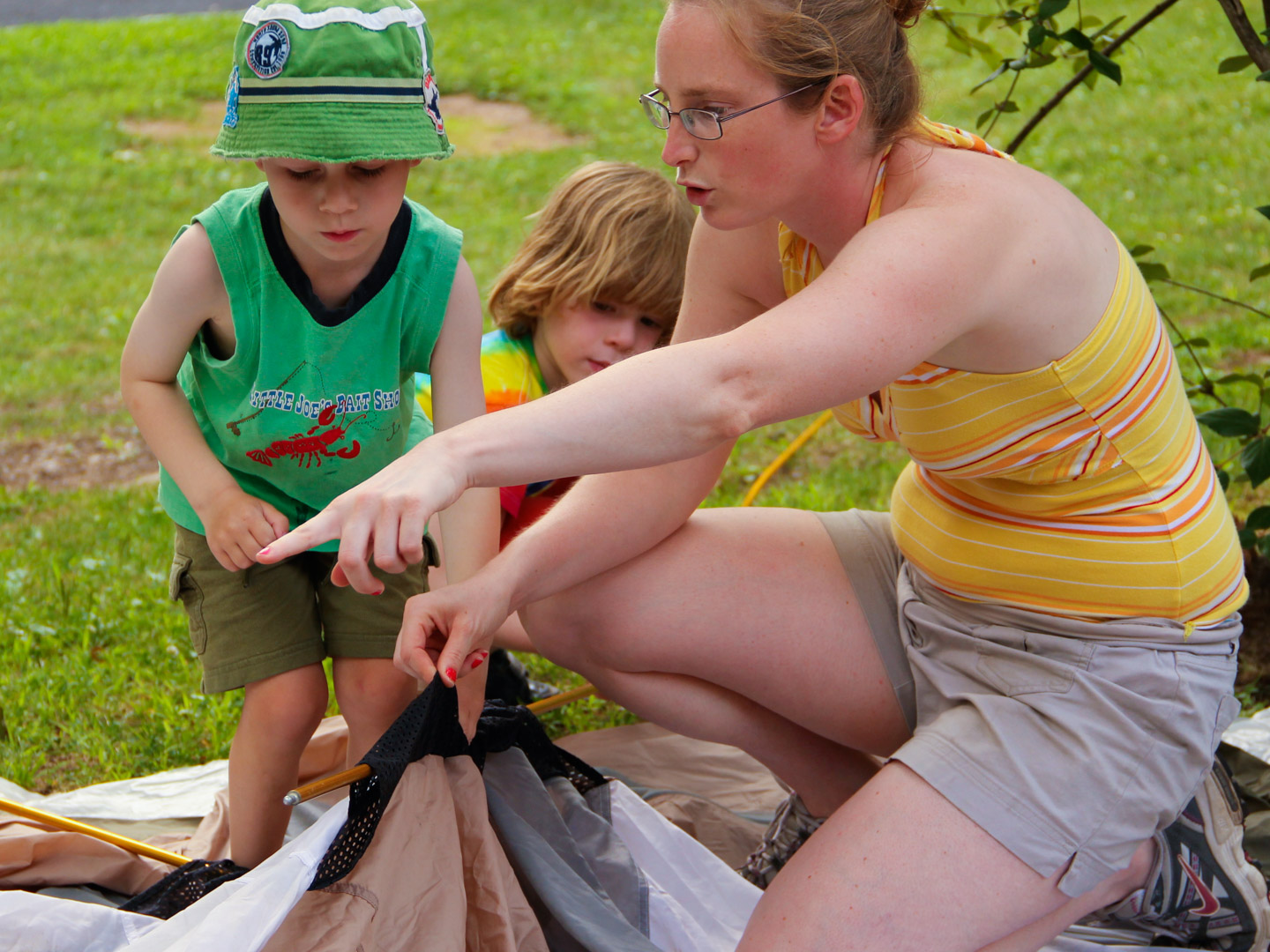 Young campers learning to put up a tent