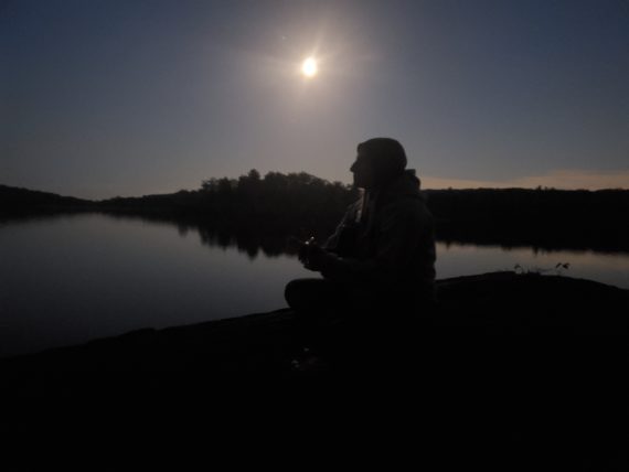 playing guitar in the moonlight at cedar pond campsite