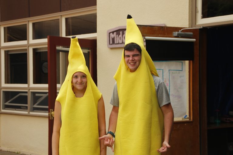 camp counselors dressed up like bananas being silly playing role models